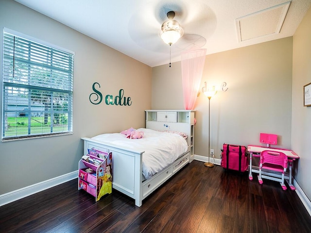 bedroom with ceiling fan and dark hardwood / wood-style flooring