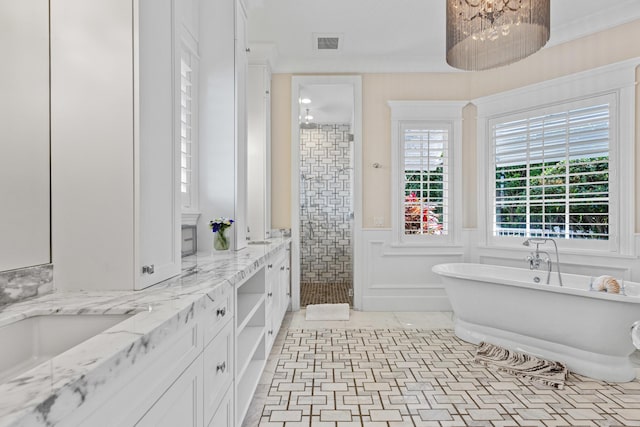 bathroom featuring ornamental molding, vanity, plus walk in shower, and tile patterned floors