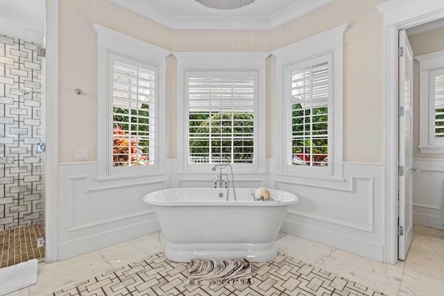 bathroom featuring ornamental molding and shower with separate bathtub