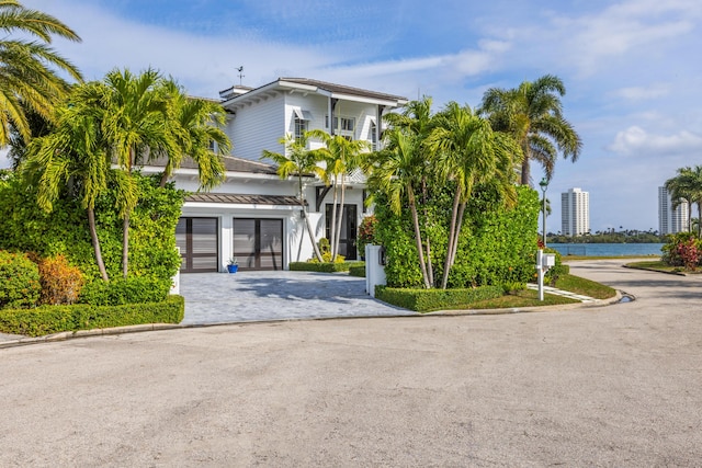 view of front of house featuring a balcony and a garage