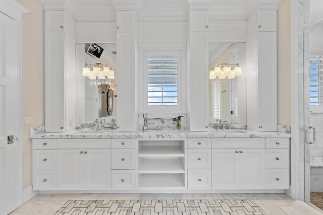 bathroom featuring vanity, crown molding, and a shower with shower door