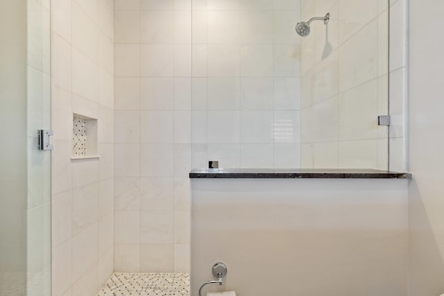 bathroom with a shower with door