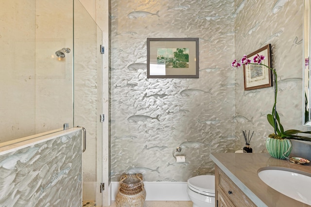 bathroom with vanity, toilet, and an enclosed shower