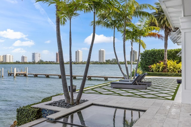 exterior space with a water view and a boat dock