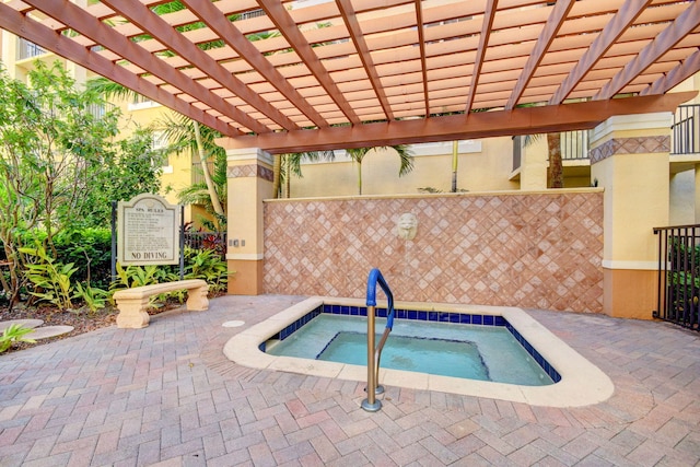 view of swimming pool featuring a hot tub and a pergola