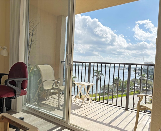 balcony featuring a water view