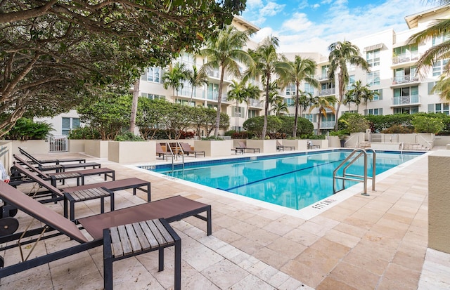 view of swimming pool featuring a patio area