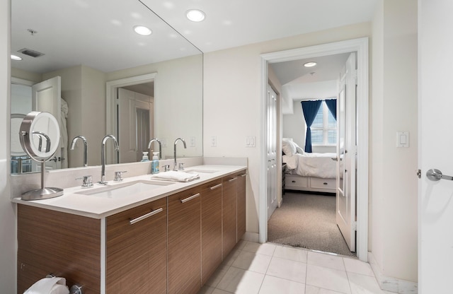 bathroom featuring tile patterned floors and vanity