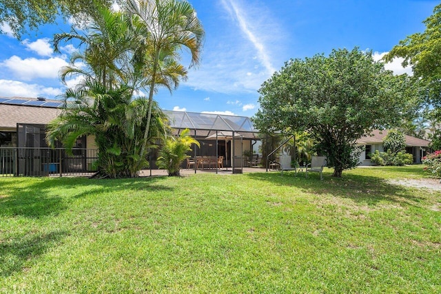 view of yard with a lanai