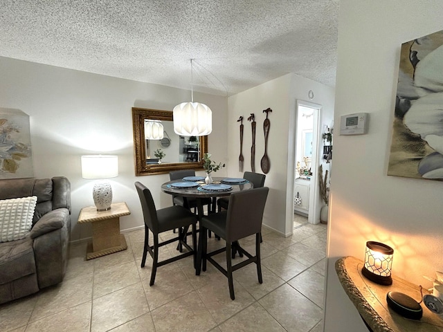 dining room featuring a textured ceiling