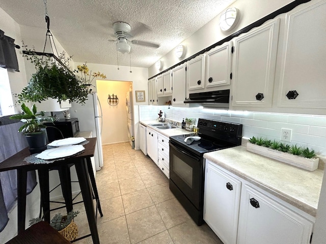 kitchen with white cabinetry, black / electric stove, decorative backsplash, ceiling fan, and light tile patterned floors