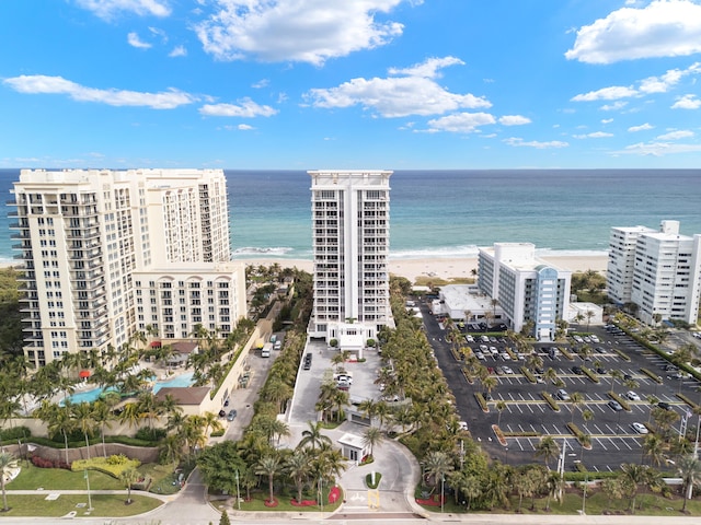 bird's eye view with a water view and a view of the beach