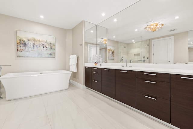 bathroom featuring vanity and separate shower and tub