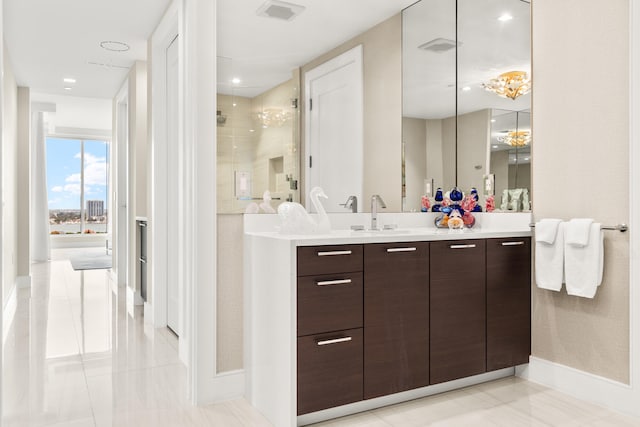 bathroom with vanity and a shower with shower door