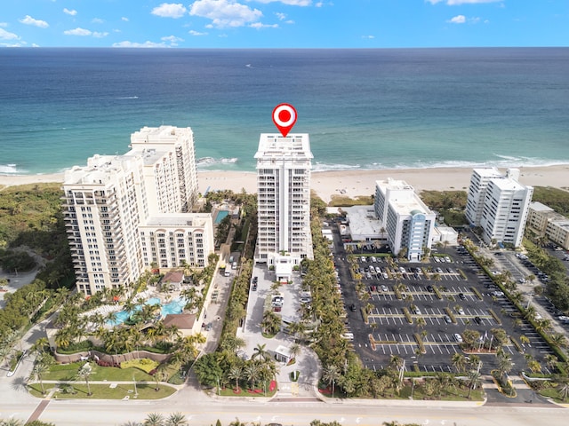 aerial view with a view of the beach and a water view