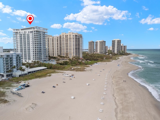 bird's eye view with a view of the beach and a water view