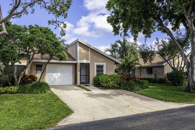 view of front facade with a garage and a front yard