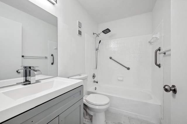 full bathroom featuring vanity, tiled shower / bath combo, and toilet