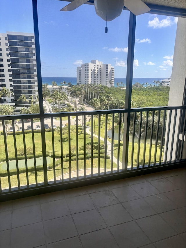 balcony with a view of city and a water view