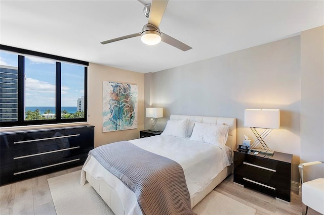 bedroom with a ceiling fan and light wood finished floors