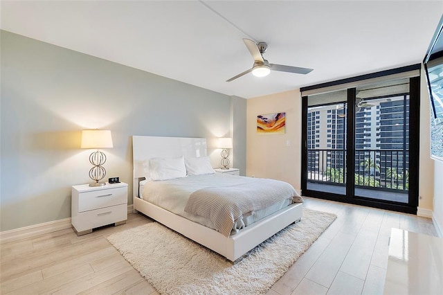 bedroom with access to outside, floor to ceiling windows, light wood-style floors, baseboards, and ceiling fan