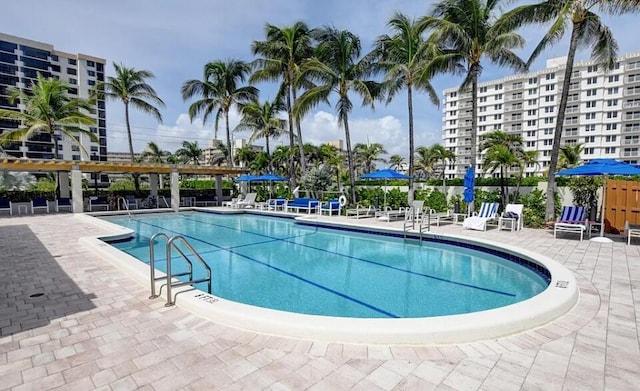 3420 S Ocean Blvd Unit 8Q, Highland Beach, FL 33487 - community pool featuring a patio