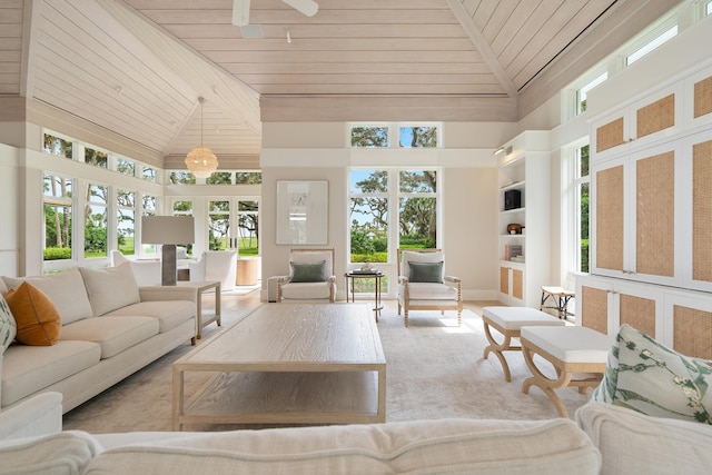 sunroom with ceiling fan, lofted ceiling, and wood ceiling