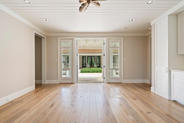 interior space featuring ceiling fan, light hardwood / wood-style flooring, and wood ceiling