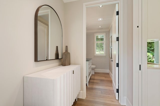 corridor with light hardwood / wood-style flooring