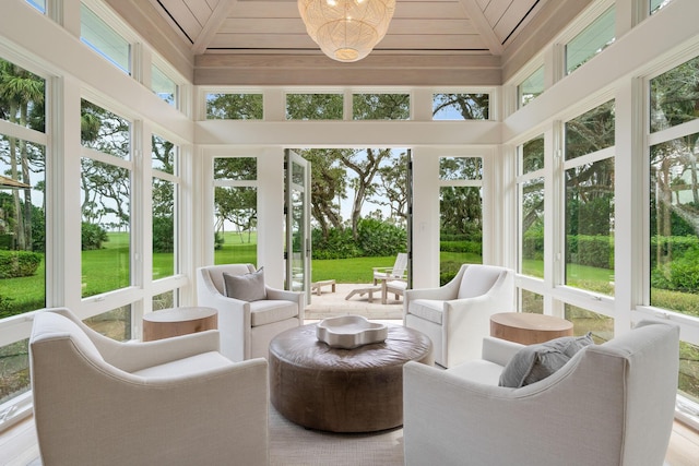 sunroom / solarium with wooden ceiling and lofted ceiling