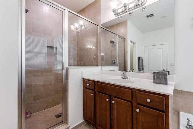 bathroom with an enclosed shower and vanity