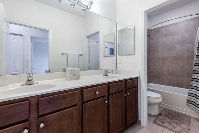 full bathroom with toilet, tile patterned flooring, vanity, and shower / bath combo with shower curtain