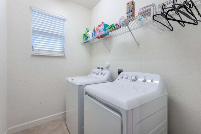 washroom with light tile patterned floors and independent washer and dryer