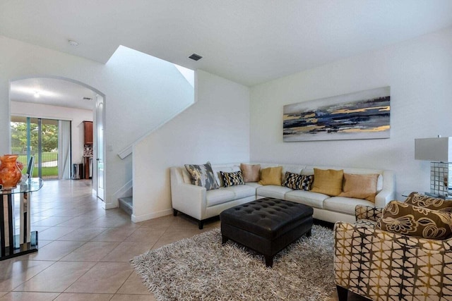 living room with tile patterned flooring