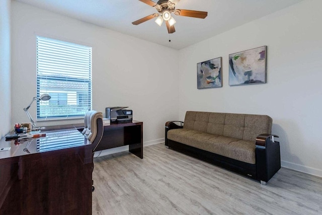 office with ceiling fan, a wealth of natural light, and light wood-type flooring