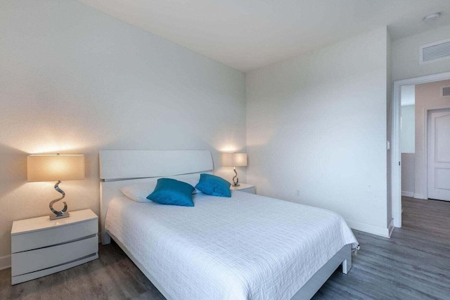 bedroom featuring dark hardwood / wood-style floors