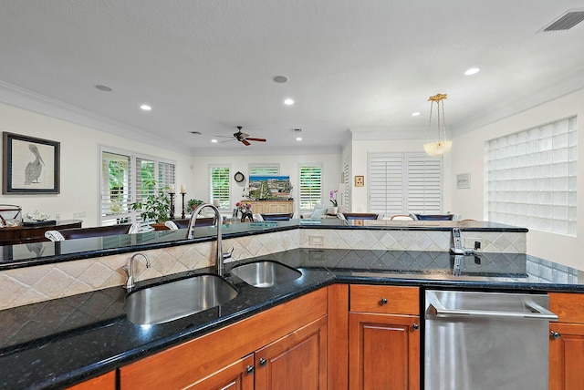 kitchen with ceiling fan, ornamental molding, pendant lighting, and stainless steel dishwasher