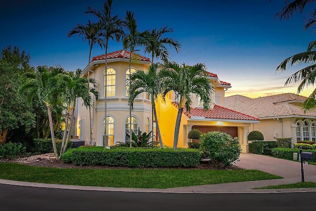 mediterranean / spanish-style home featuring a garage