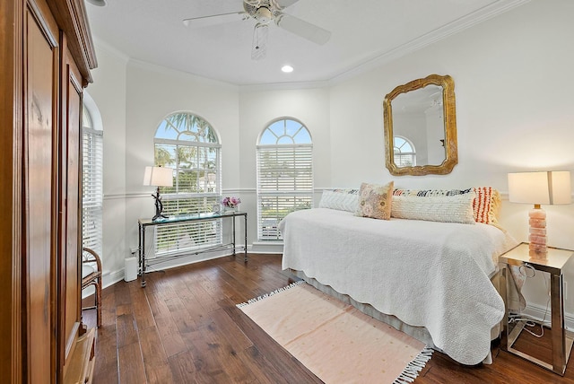 bedroom featuring ceiling fan, dark hardwood / wood-style floors, and ornamental molding