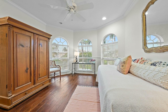 bedroom featuring ceiling fan, dark wood-type flooring, and crown molding