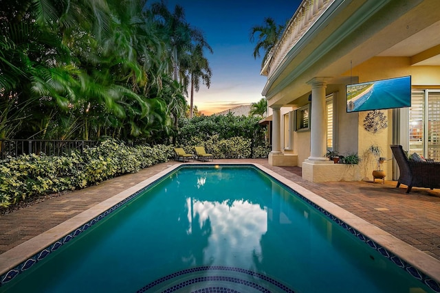 view of swimming pool with a patio