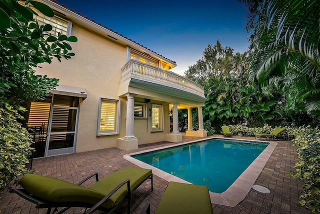 view of pool featuring a patio