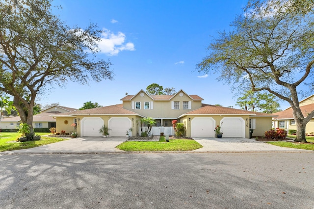 view of front of house featuring a garage and a front yard