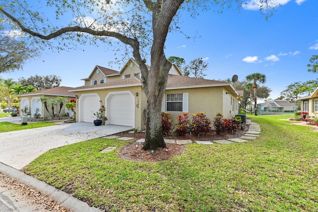 view of front of home featuring a garage and a front lawn