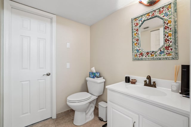 bathroom with tile patterned floors, vanity, and toilet