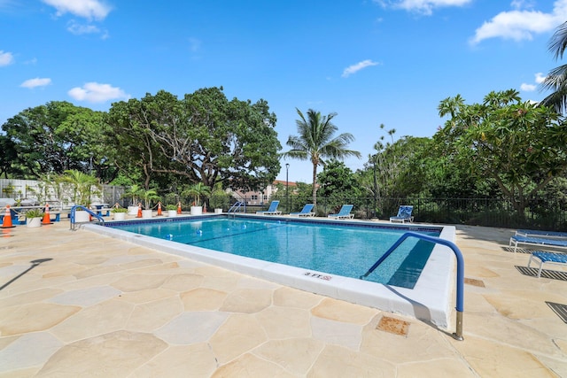 view of swimming pool with a patio