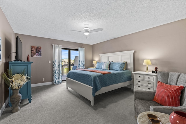 carpeted bedroom with a textured ceiling, ceiling fan, and access to exterior