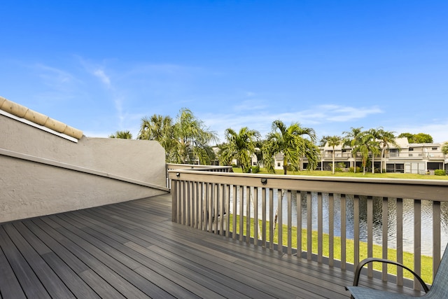 wooden deck featuring a water view