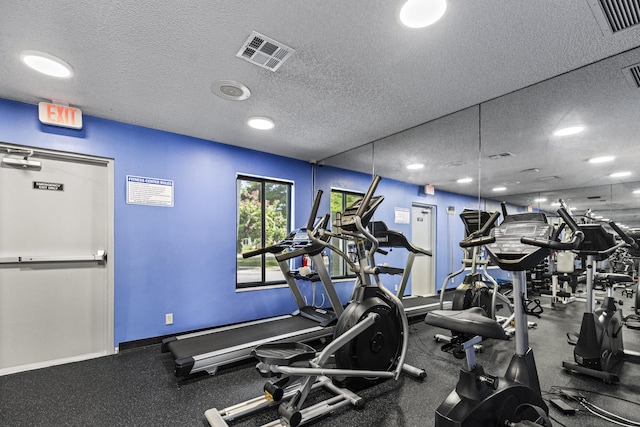 gym with a textured ceiling