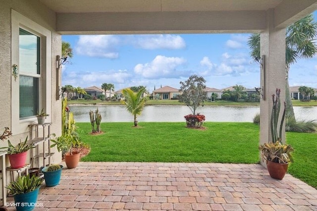 view of patio with a water view